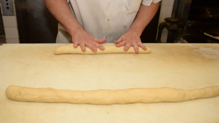 Roll each piece of dough under your palms into two 22-inch ropes. They will be shorter if rolling three pieces. The ropes should taper out at each end. 