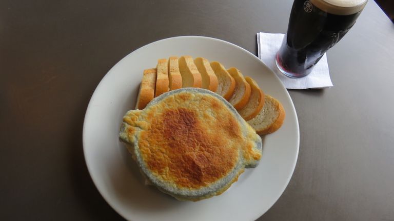 Irish stew is like a pot roast, except it's always made with lamb. In this traditional dish, lamb is braised along with root vegetables and potatoes. At the Dog and Duck, it's served in the style of a chicken pot pie, with a pastry crust. But that's not how it would be served in an Irish home, Connolly said. It would just be a stew, with nothing fancy like a crust on top. He runs a restaurant, he said, where presentation goes a long way. 