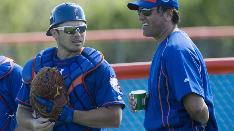 New York Mets catcher Travis d'Arnaud talks with former Mets catcher Mike Piazza on Sunday Feb. 28, 2016 during a spring training workout in Port St. Lucie, Fla.