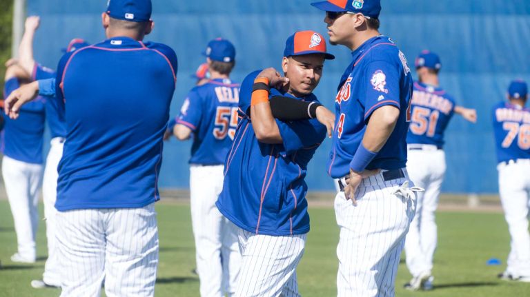 New York Mets shortstop Ruben Tejada stretches on Sunday Feb. 28, 2016 during a spring training workout in Port St. Lucie, Fla.