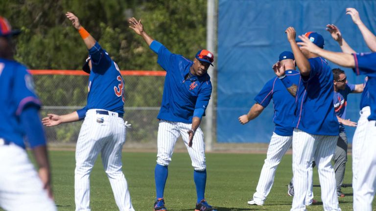 New York Mets outfielder Curtis Granderson stretches on Sunday Feb. 28, 2016 during a spring training workout in Port St. Lucie, Fla.