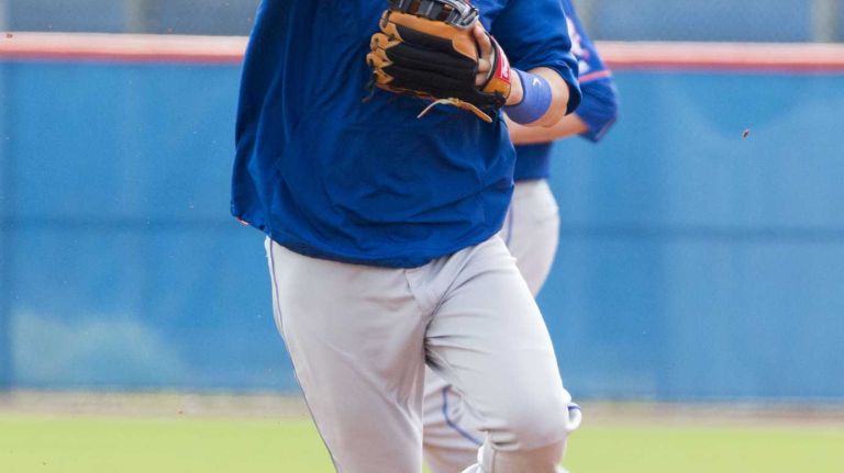 New York Mets infielder Wilmer Flores does a drill on Monday, Feb. 29, 2016 during a spring training workout in Port St. Lucie, Fla.