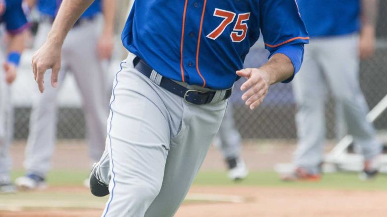 New York Mets infielder T.J. Rivera does running drills on Monday, Feb. 29, 2016 during a spring training workout in Port St. Lucie, Fla.
