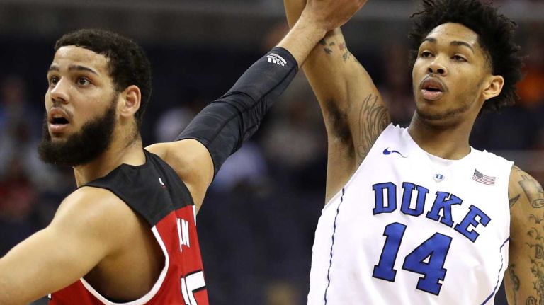 Brandon Ingram #14 of the Duke Blue Devils shoots in front of Cody Martin #15 of the North Carolina State Wolfpack during the first half in the second round of the 2016 ACC Basketball Tournament at Verizon Center on March 9, 2016 in Washington, DC. 