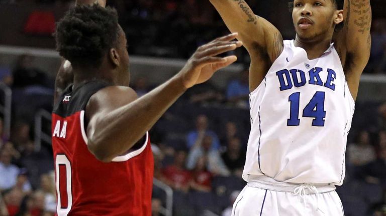 Brandon Ingram #14 of the Duke Blue Devils shoots in front of Abdul-Malik Abu #0 of the North Carolina State Wolfpack during the first half in the second round of the 2016 ACC Basketball Tournament at Verizon Center on March 9, 2016 in Washington, DC.