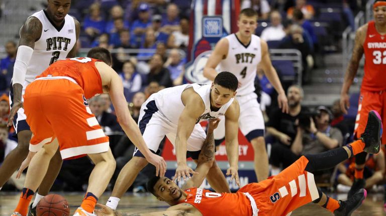 Syracuse vs. Pitt in ACC Tournament 11 Michael Gbinije #0 of the Syracuse Orange and James Robinson #0 of the Pittsburgh Panthers battle for a loose ball during the second half in the second round of the 2016 ACC Basketball Tournament at Verizon Center on March 9, 2016 in Washington, DC. Pittsburgh Panthers won, 72-71.
