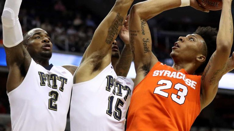 Syracuse vs. Pitt in ACC Tournament 16 Malachi Richardson #23 of the Syracuse Orange puts up a shot in front of Sterling Smith #15 and Michael Young #2 of the Pittsburgh Panthers during the first half in the second round of the 2016 ACC Basketball Tournament at Verizon Center on March 9, 2016 in Washington, DC.
