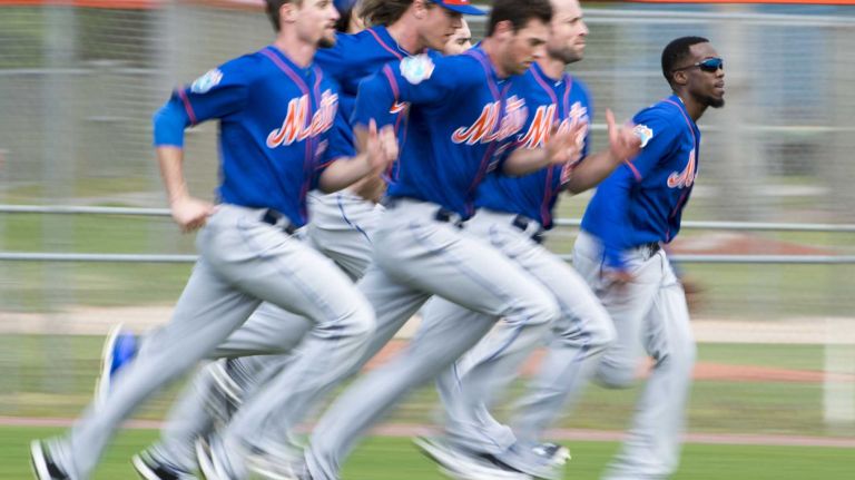 New York Mets pitchers sprint during a spring training workout on Sunday, Feb. 21, 2016 in Port St. Lucie, Fla.