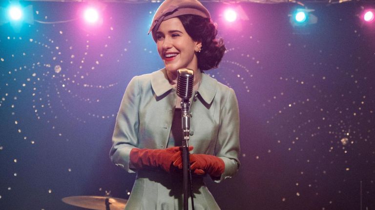 Midge's hairstyle in "The Marvelous Mrs. Maisel" is built to accommodate her vibrant hats. 