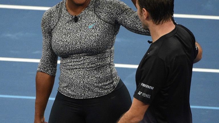 Serena Williams high fives Stan Wawrinka while playing a game of doubles against Gael Monfils and Caroline Wozniacki during the 9th annual BNP Paribas Showdown at Madison Square Garden on Tuesday, March 8, 2016.