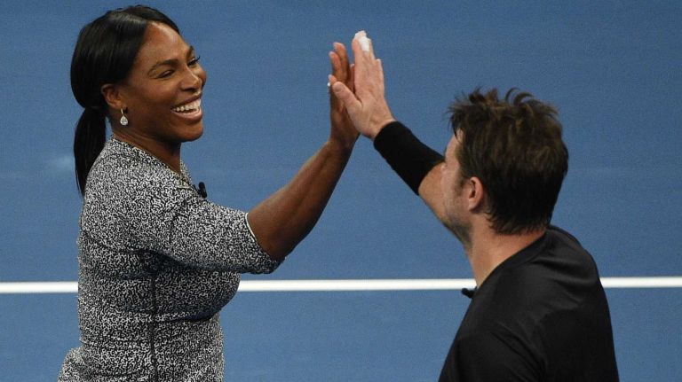 Serena Williams high fives Stan Wawrinka while playing a game of doubles against Gael Monfils and Caroline Wozniacki during the 9th annual BNP Paribas Showdown at Madison Square Garden on Tuesday, March 8, 2016.