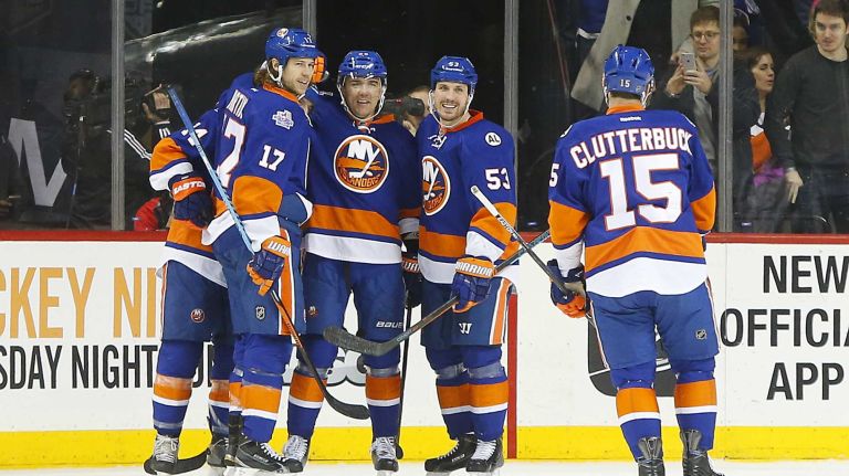 Marek Zidlicky #28 of the New York Islanders celebrates his second period goal against the Detroit Red Wings with his teammates at Barclays Center on Monday, Feb. 15, 2016 in Brooklyn, New York.
