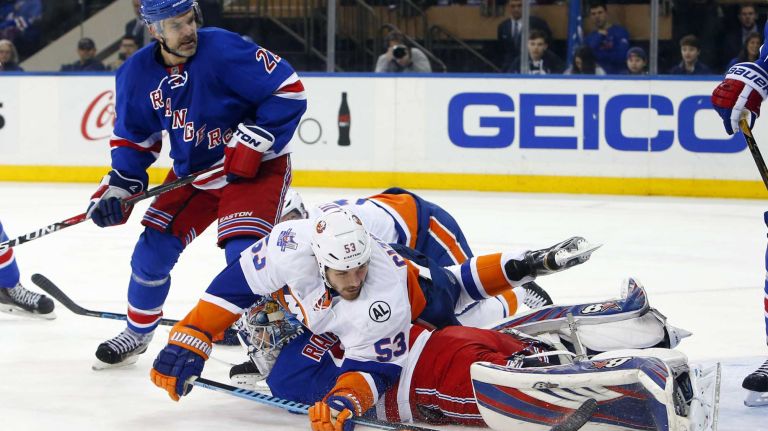 Islanders vs. Rangers 24 Antti Raanta of the New York Rangers makes a save in the second period against Casey Cizikas of the New York Islanders at Madison Square Garden on Sunday, March 6, 2016.