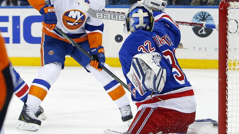 Islanders vs. Rangers 26 Antti Raanta of the New York Rangers makes a save in the second period as John Tavares of the New York Islanders moves in for a rebound at Madison Square Garden on Sunday, March 6, 2016.
