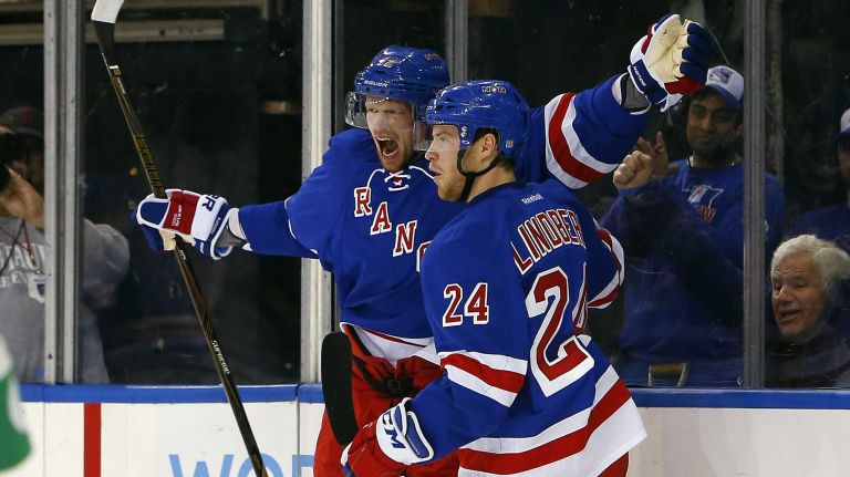 Islanders vs. Rangers 28 Eric Staal of the New York Rangers celebrates his first-period goal against the New York Islanders with teammate Oscar Lindberg at Madison Square Garden on Sunday, March 6, 2016.