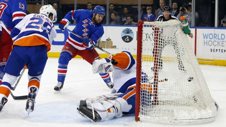 Islanders vs. Rangers 30 Tanner Glass of the New York Rangers scores a first-period goal past Jaroslav Halak of the New York Islanders at Madison Square Garden on Sunday, March 6, 2016.