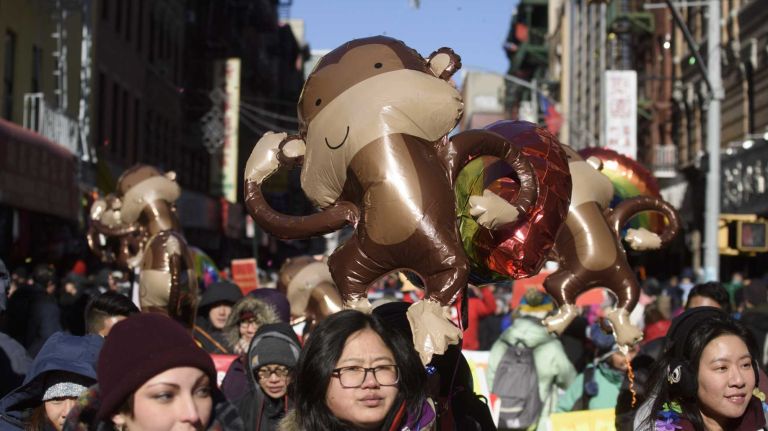 Participants carry inflatable monkeys as they welcome the Year of the Monkey during the annual Lunar New Year Parade in Manhattan's Chinatown on Sunday, Feb. 14, 2016. The monkey is the ninth of the 12-year cycle of animals that appear in the Chinese zodiac, related to the Chinese calendar.