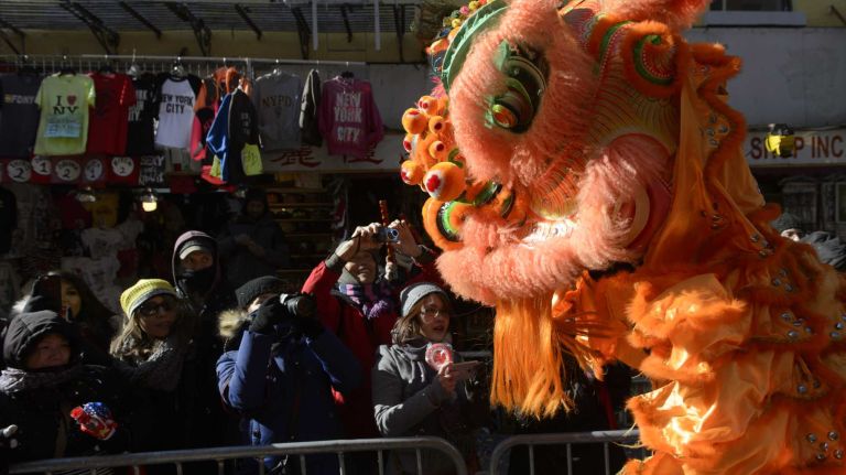 Participants and spectators welcome the Year of the Monkey during the annual Lunar New Year Parade in Manhattan's Chinatown on Sunday, Feb. 14, 2016. The monkey is the ninth of the 12-year cycle of animals that appear in the Chinese zodiac, related to the Chinese calendar.