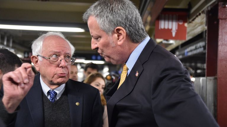 Bernie Sanders endorses New York City Mayor Bill de Blasio and campaigns  alongside him at the A train  stop of Penn Station   in Manhattan Oct.  30,  2017. 