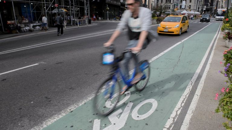A bicyclist on a bike lane on Broadway near 24th Street in Manhattan. 
