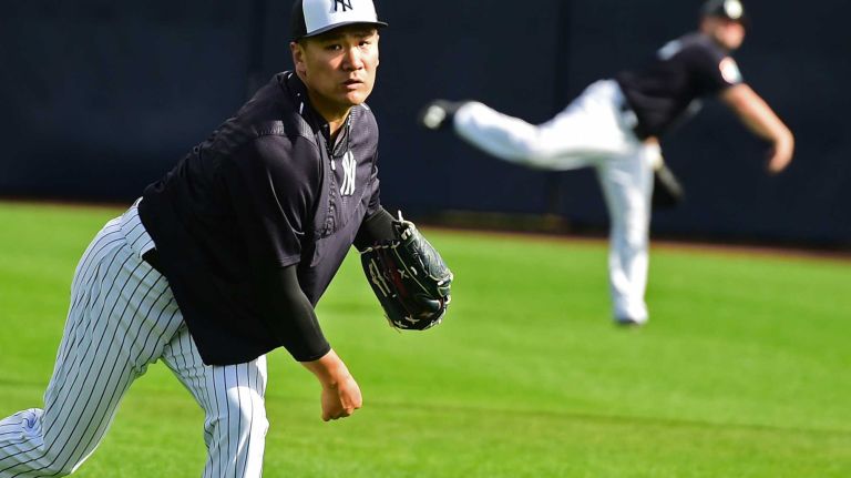 New York Yankees spring training 2016 121 New York Yankees pitcher Masahiro Tanaka and Brian McCann practice throwing long ball during spring training at George M. Steinbrenner Field in Tampa, Fla., on Wednesday, Feb. 24, 2016.