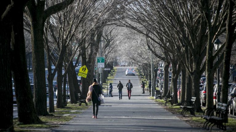 People walk along Eastern Parkway in Crown Heights, Brooklyn on Jan. 13, 2016.