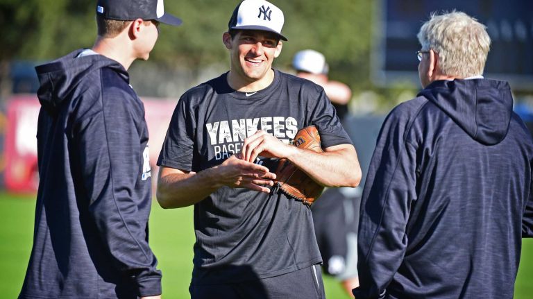 New York Yankees spring training 2016 158 New York Yankees' Nathan Eovaldi, center, works out during the first day of spring training at George M. Steinbrenner Field in Tampa Fla. on Thursday, Feb. 18, 2016.