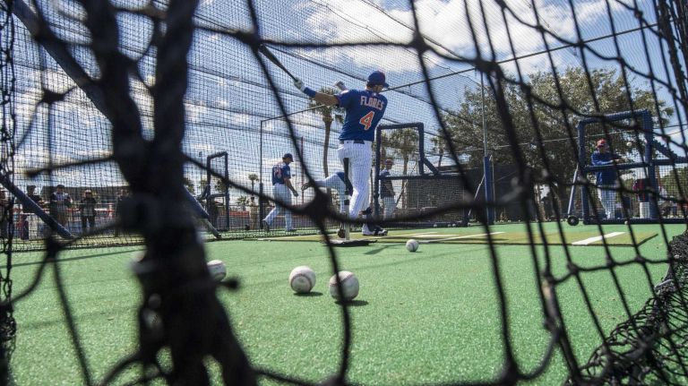 New York Mets' Wilmer Flores takes batting practice on Sunday Feb. 28, 2016 during a spring training workout in Port St. Lucie, Fla.