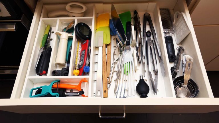 Divide your tool drawer into discrete sections for beverage-related tools (corkscrews, bottle openers), tools with blades (peelers, shears, can-openers), spoon-ish tools (ice cream scoops, slotted spoons) and so on.