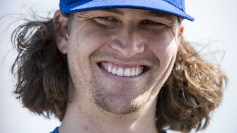 New York Mets pitcher Jacob deGrom smiles during a spring training workout, Tuesday Feb 16, 2016 in Port St. Lucie, FL.