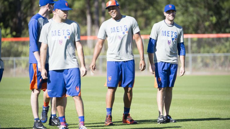 New York Mets pitcher Jeurys Familia (center) laughs during a spring training workout, Wednesday, Feb. 17, 2016 in Port St. Lucie, Fla.