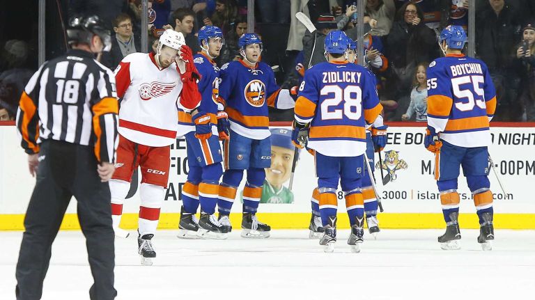 Josh Bailey #12 of the New York Islanders celebrates his second period goal against the Detroit Red Wings with teammates Brock Nelson #29, Marek Zidlicky #28 and Johnny Boychuk #55 at Barclays Center on Monday, Feb. 15, 2016 in Brooklyn, New York.