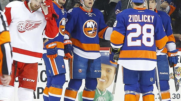 Josh Bailey #12 of the New York Islanders celebrates his second period goal against the Detroit Red Wings with teammates Brock Nelson #29 and Marek Zidlicky #28 at Barclays Center on Monday, Feb. 15, 2016 in Brooklyn, New York.