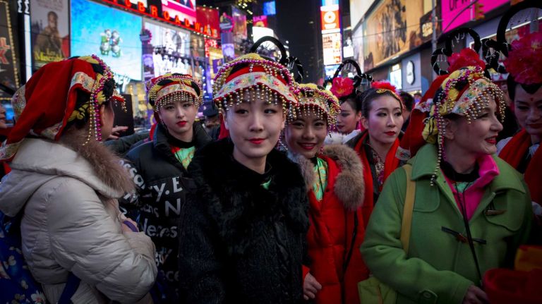 New Year's Eve in NYC 2015 to 2016: Pictures of the ball drop in Times Square and more 44 Sino American Friendship Association performers stand by during the New Year's Eve event in Times Square in Manhattan, on Dec. 31, 2015.