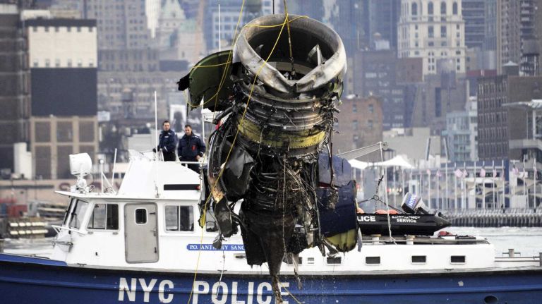 Workers lift the port engine of US Airways 1549 from the Hudson River on Jan. 24, 2009. The plane landed in the Hudson River on Jan. 15, 2009.