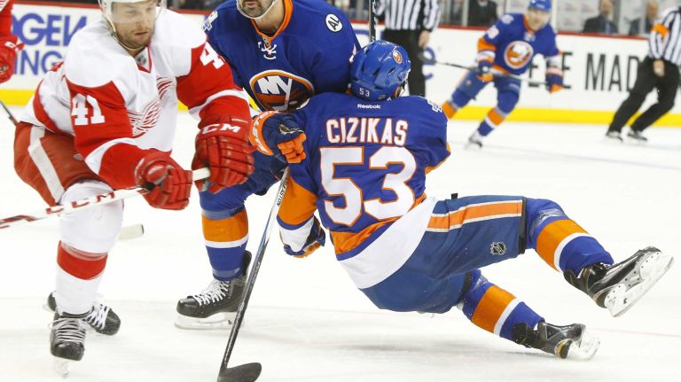 Casey Cizikas #53 of the New York Islanders collides with teammate Cal Clutterbuck #15 during the first period against the Detroit Red Wings at Barclays Center on Monday, Feb. 15, 2016 in Brooklyn, New York.