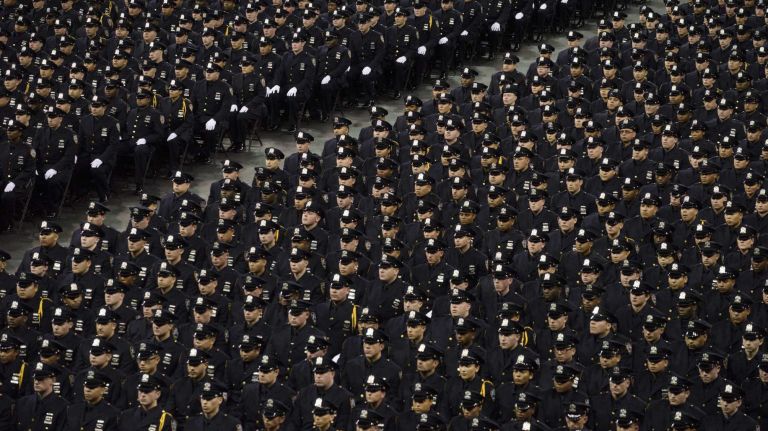 NYPD officer graduations, Dec. 29, 2015 12 Cadets attend the New York Police Department Police Academy graduation ceremony at Madison Square Garden in Manhattan on Tuesday, Dec. 29, 2015. More than 1,200 new police officers took part in the graduation ceremony.