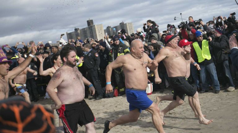 Swimmers and waders eagerly jump in at the Coney Island Polar Bear Plunge in Brooklyn, on Jan. 1, 2016.