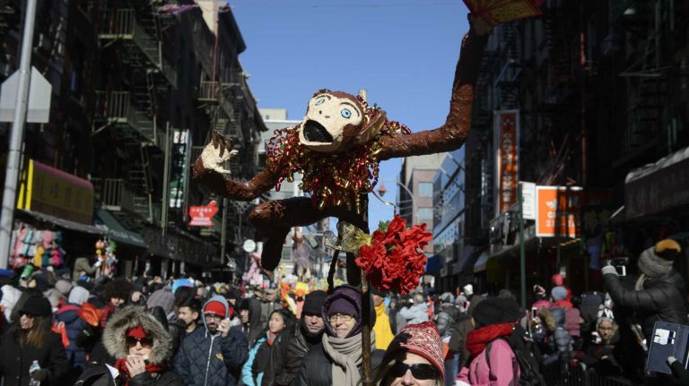 Participants and spectators welcome the Year of the Monkey during the annual Lunar New Year Parade in Manhattan's Chinatown on Sunday, Feb. 14, 2016. The monkey is the ninth of the 12-year cycle of animals that appear in the Chinese zodiac, related to the Chinese calendar.