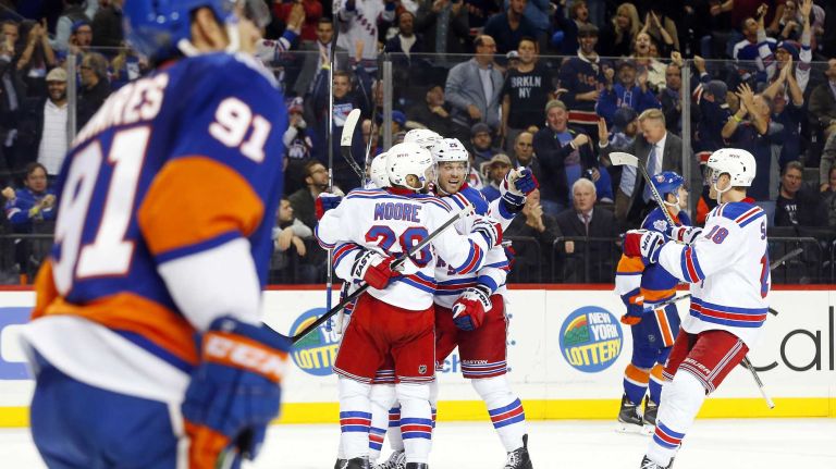 Viktor Stalberg #25 of the New York Rangers celebrates his second period goal against the New York Islanders with his teammates at Barclays Center on Wednesday, Dec. 30, 2015 in Brooklyn, New York.