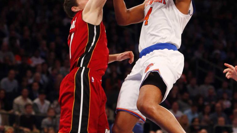 Knicks vs. Heat 18 Arron Afflalo #4 of the New York Knicks takes a shot against Goran Dragic #7 of the Miami Heat at Madison Square Garden on Friday, Nov. 27, 2015 in New York City.