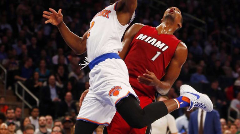 Knicks vs. Heat 19 Langston Galloway #2 of the New York Knicks goes to the hoop against Chris Bosh #1 of the Miami Heat at Madison Square Garden on Friday, Nov. 27, 2015 in New York City.