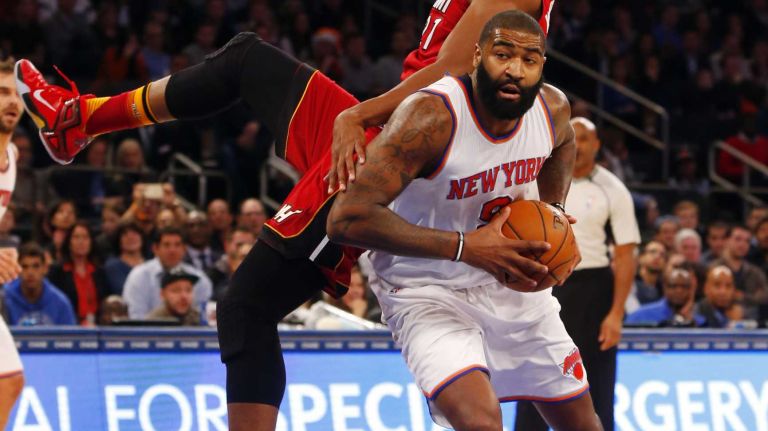 Knicks vs. Heat 23 Kyle O'Quinn #9 of the New York Knicks attempts to get to the net in the first half against Hassan Whiteside #21 of the Miami Heat at Madison Square Garden on Friday, Nov. 27, 2015 in New York City.