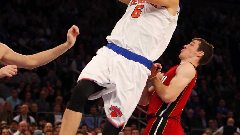 Knicks vs. Heat 31 Kristaps Porzingis #6 of the New York Knicks attempts a shot against the Miami Heat at Madison Square Garden on Friday, Nov. 27, 2015 in New York City.