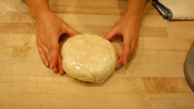 Using spatula, move dough to counter and shape into a round. Wrap in plastic wrap and chill in refrigerator for at least one hour.