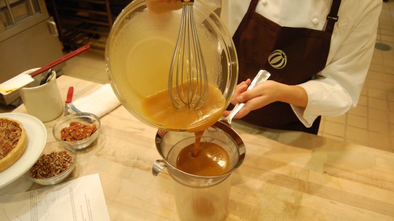 This extra step is not completely necessary, but Chef Ali recommends it. By passing the filling through a strainer you will ensure any tiny chunks won't make it into the pie. Consistency is everything.