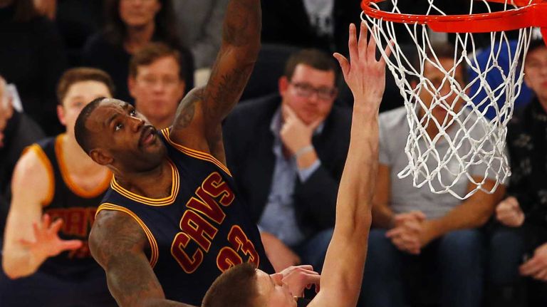 LeBron James #23 of the Cleveland Cavaliers puts up a shot for a basket in the fourth quarter against Kristaps Porzingis #6 of the New York Knicks at Madison Square Garden on Friday, Nov. 13, 2015 in New York City.