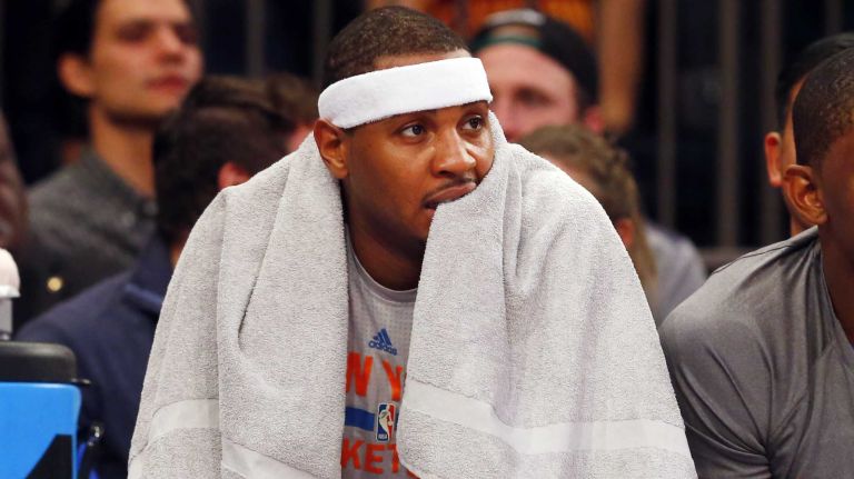 Carmelo Anthony #7 of the New York Knicks looks on from the bench against the Cleveland Cavaliers at Madison Square Garden on Friday, Nov. 13, 2015 in New York City.