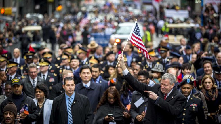 Mayor Bill de Blasio marches in the 96th annual New York City Veterans Day Parade in lower Manhattan on Wednesday, Nov. 11, 2015.