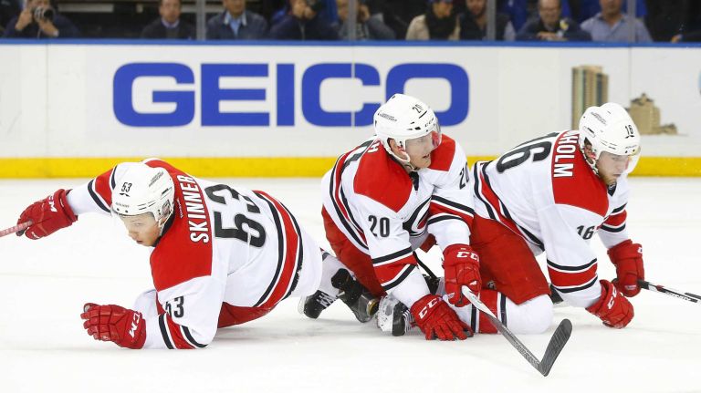 Jeff Skinner #53, Riley Nash #20 and Elias Lindholm #16 of the Carolina Hurricanes collide in the second period against the New York Rangers at Madison Square Garden on Tuesday, Nov. 10, 2015.
